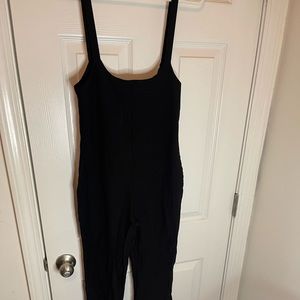 Black PLT jumper bell bottom flare at the bottom of pants